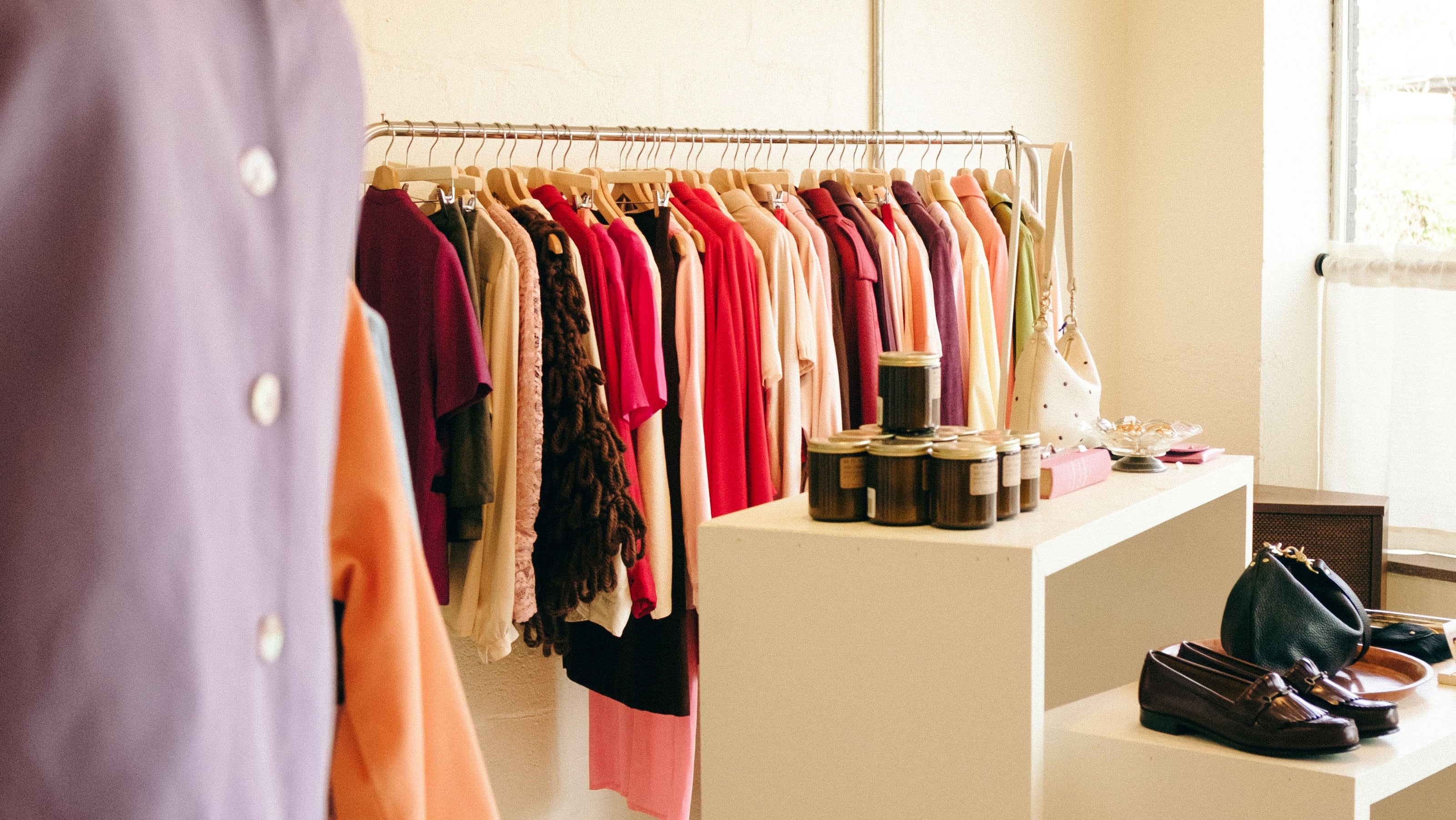 Clothing rack with colorful shirts in Retrolocal